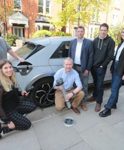 Trojan Energy team with on-street charge point and EV