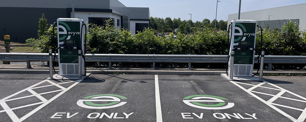 Two evyve chargers with parking bays that have EV ONLY signage