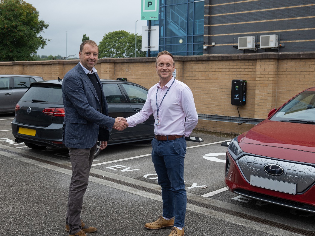 Zest CEO, Robin Heap with WYFRS Head of Estates, Richard Young in front of a charge point