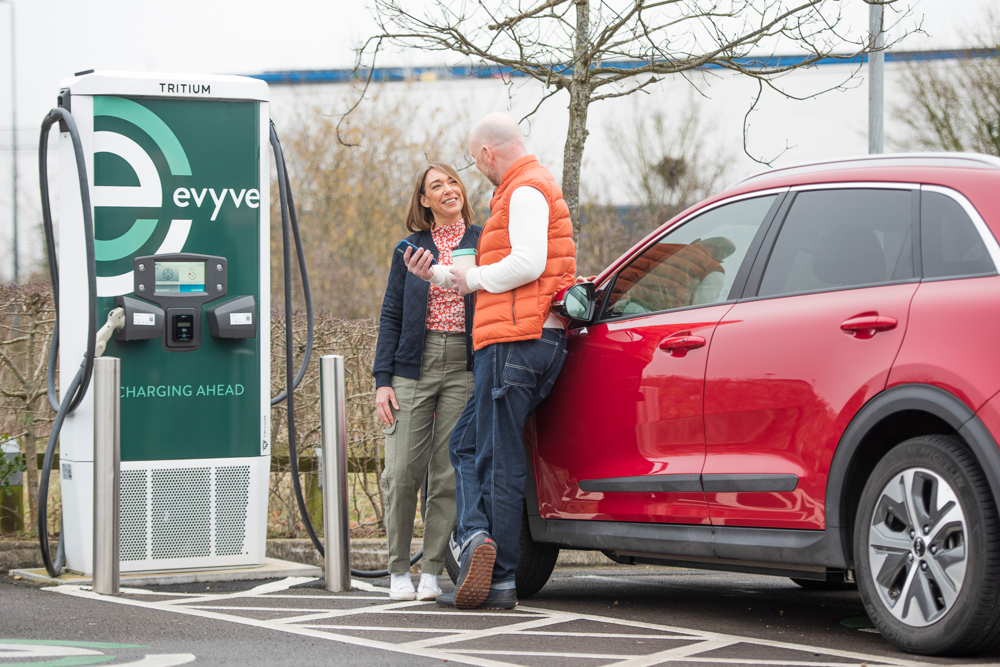 Couple charging at evyve charger