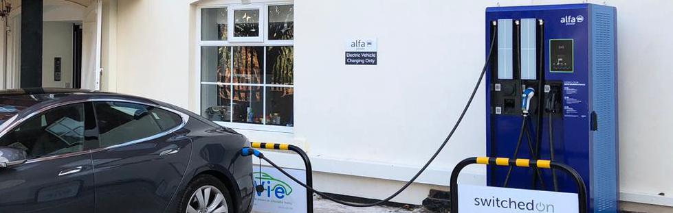 Alfa power charge point charges black tesla