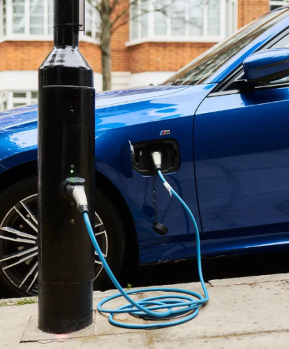 on-street lamp post charger charging a blue EV