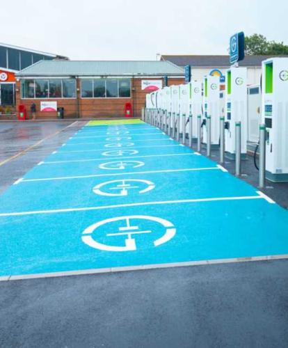 GRIDSERVE charge points with bright blue parking bays in front of Roadchef motorway services