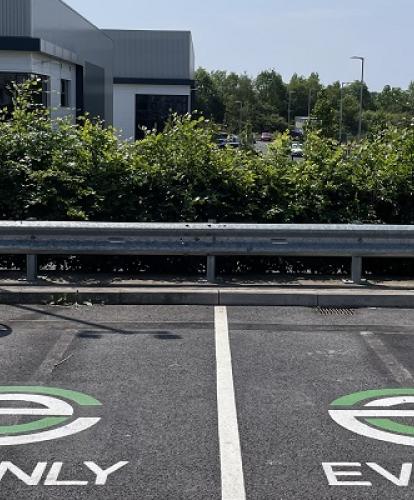 Two evyve chargers with parking bays that have EV ONLY signage