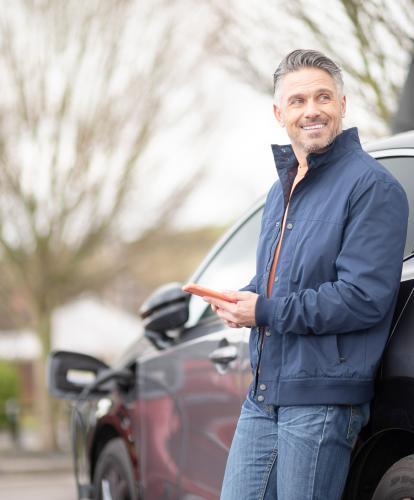 Man uses Zapmap app to check on status of EV charging 