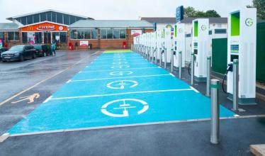 GRIDSERVE charge points with bright blue parking bays in front of Roadchef motorway services