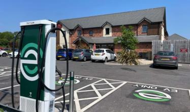evyve charger in a car park in front of pub