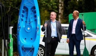 Be.EV launches at Sale water park, 2 council members stand next to a kayak near ev charge points