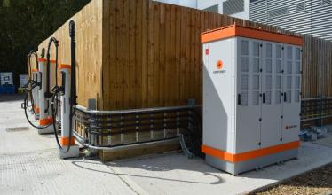 Kempower Satellite Chargers in front of fence at UTAC