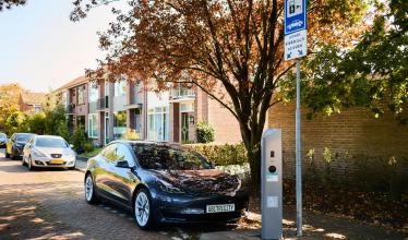 ubitricity on-street charge point charging EV under a tree