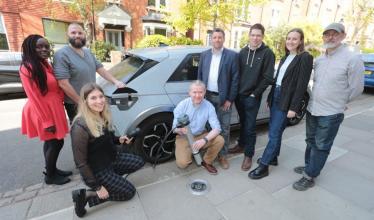 Trojan Energy team with on-street charge point and EV