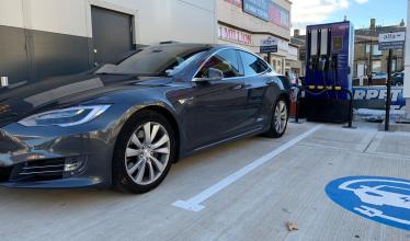 Alfa power charge point charges black tesla