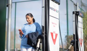 Woman uses Zapmap app at Instavolt charge points