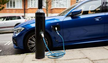 Ubitricity lamp post charger with a blue EV plugged in